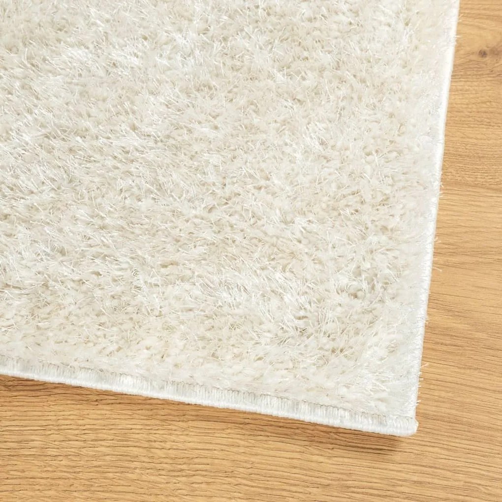 ISTAN krémszínű hosszú szálú fényes szőnyeg 140 x 200 cm