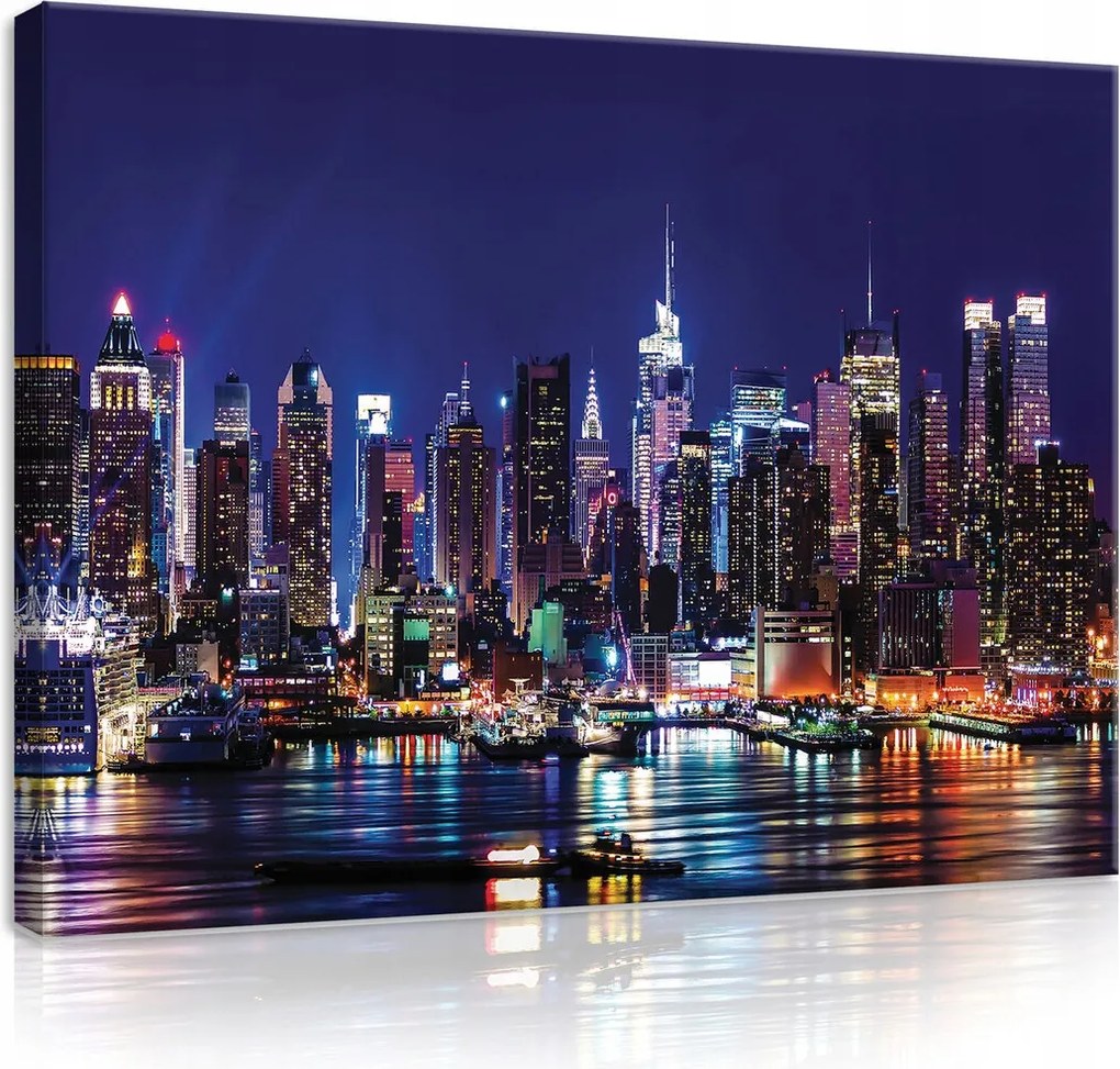 Vászonkép 80x60 New York éjszakai tájkép felhőkarcolók fények város tükröződés