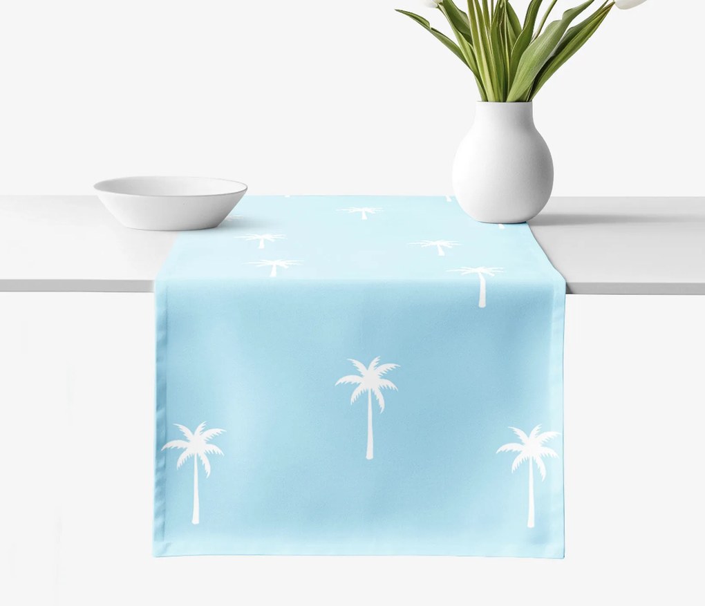Goldea pamut asztali futó - pálmák pasztell kék alapon 50x120 cm