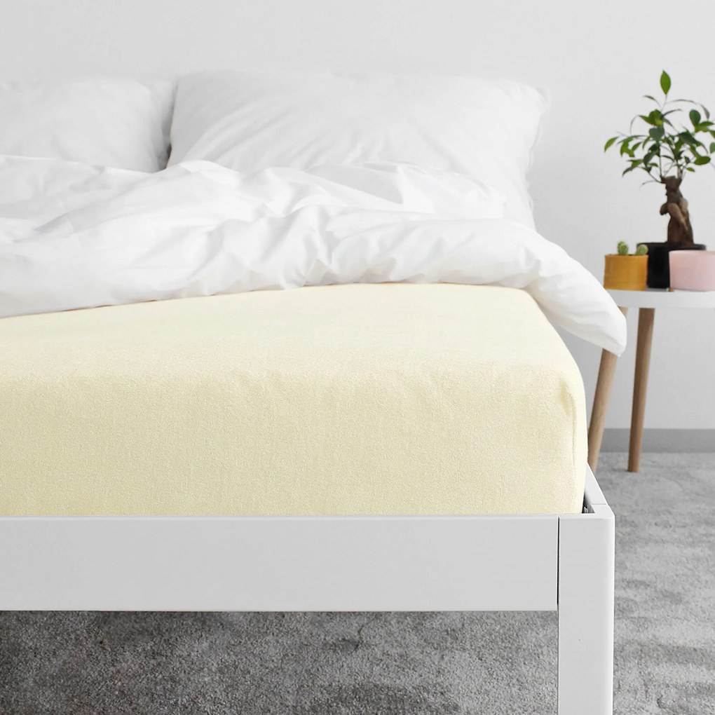 Goldea frottír gumis lepedő - világossárga 90 x 200 cm