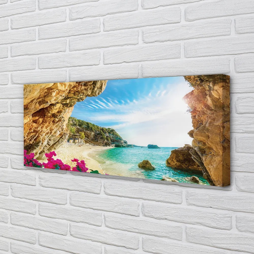 Canvas képek Görögország parti sziklák virágok 125x50 cm