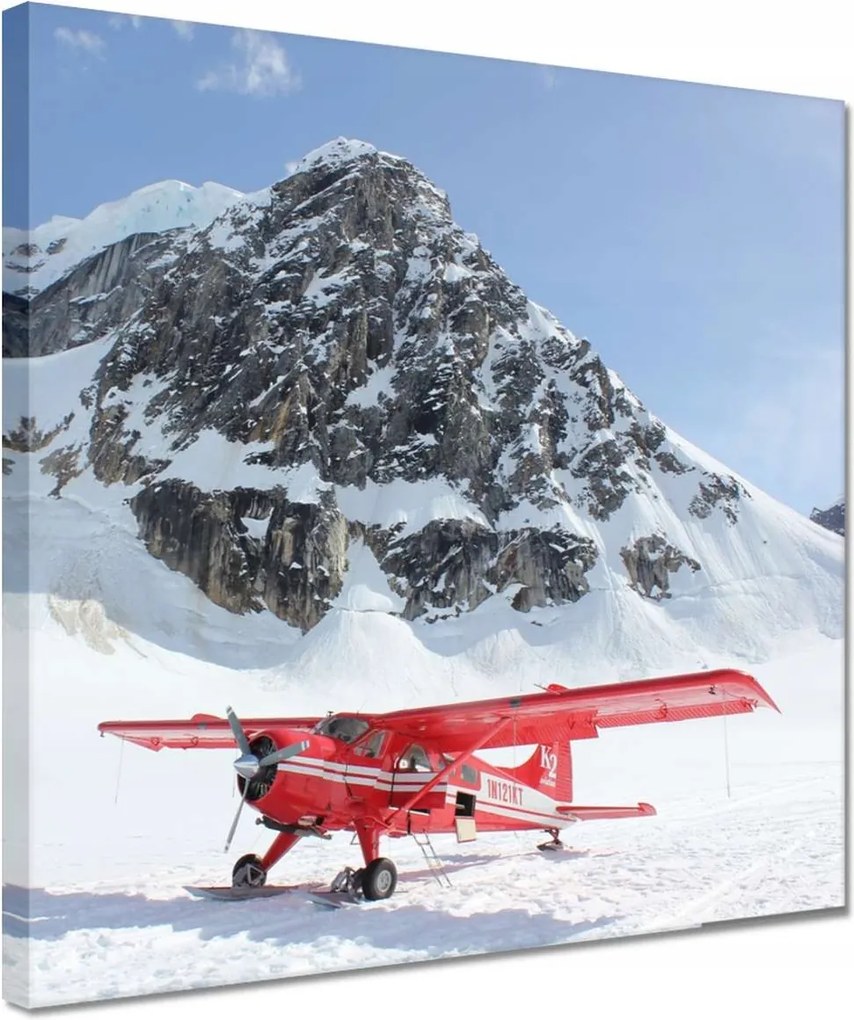 Vászonkép 30x30 Piros repülőgép a hegyekben