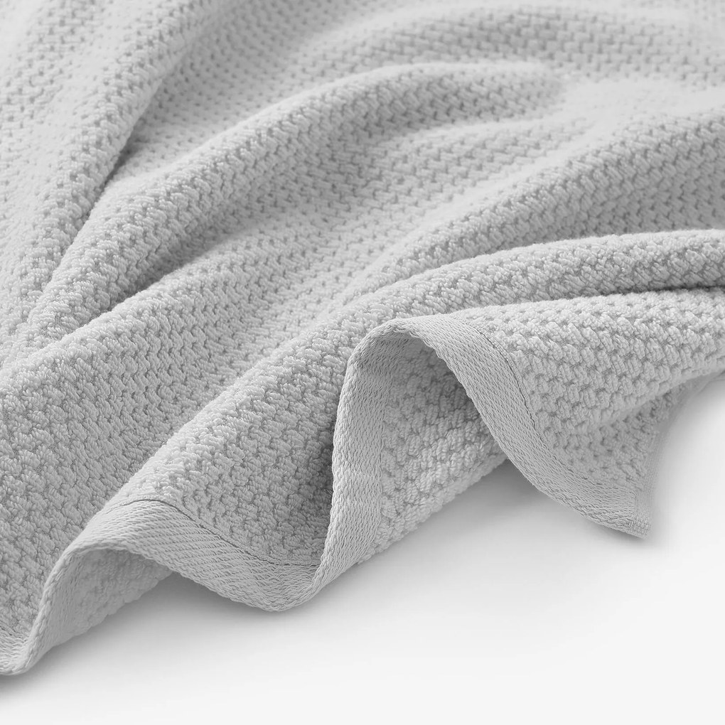 Goldea pamut frotír törölköző / fürdőlepedő micro pure - világosszürke 30 x 50 cm