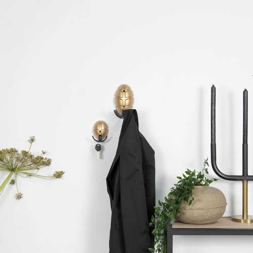 Fekete-aranyszínű fali műanyag akasztó Tick – Spinder Design