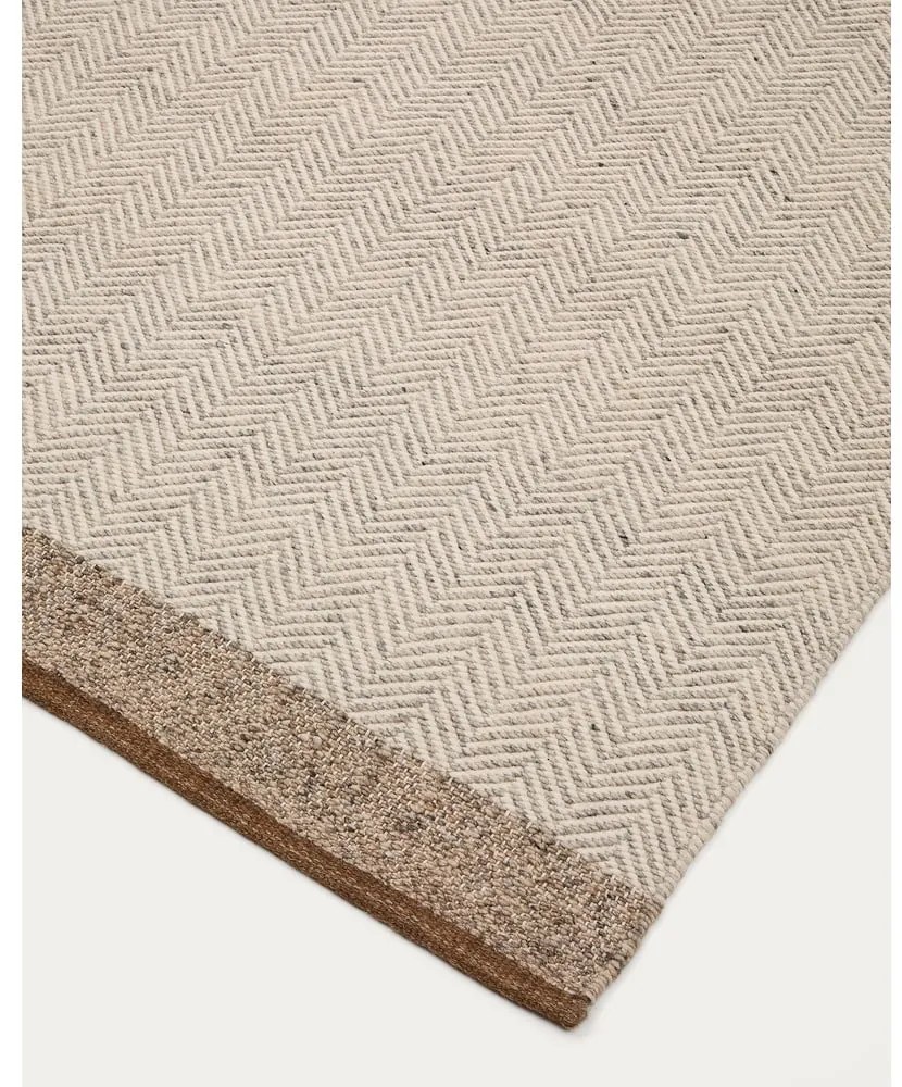 Bézs kétoldalas kézi szövésű gyapjú szőnyeg 160x230 cm Nifelia – Kave Home