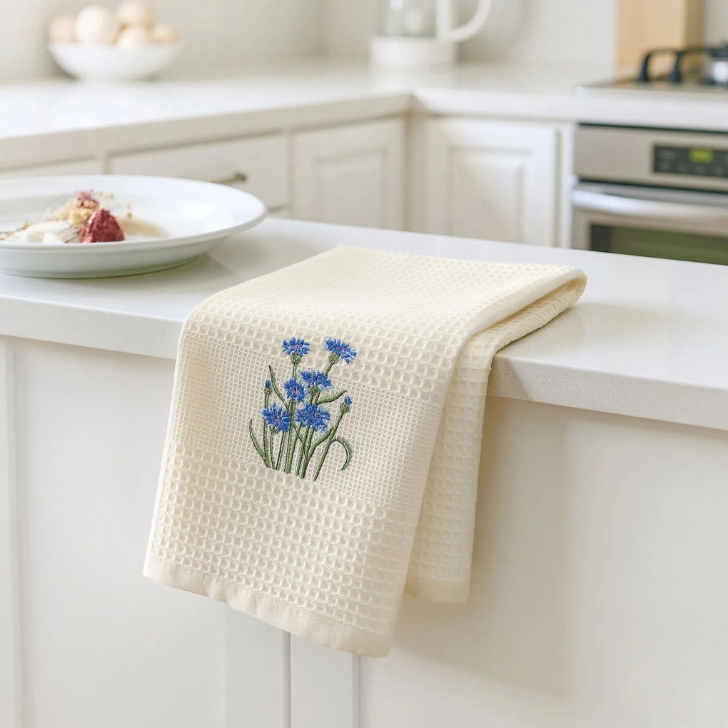 Goldea hímzett waffle konyharuha - búzavirág krémszínű alapon 50 x 70 cm