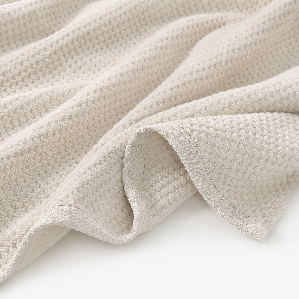 Goldea pamut frotír törölköző / fürdőlepedő micro pure - mandulaszín 50 x 100 cm