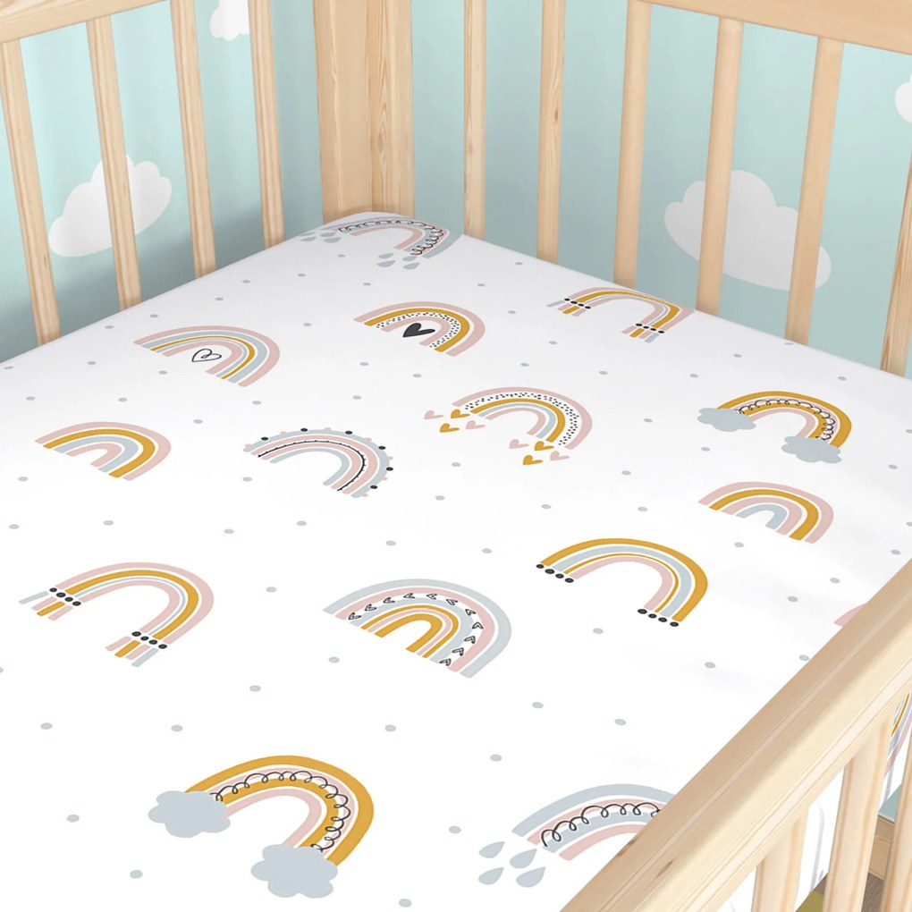 Goldea gyermek gumis pamut lepedő kiságyba - festett szivárványok 70 x 140 cm