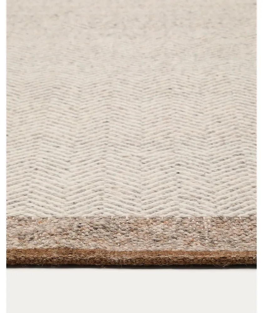 Bézs kétoldalas kézi szövésű gyapjú szőnyeg 160x230 cm Nifelia – Kave Home