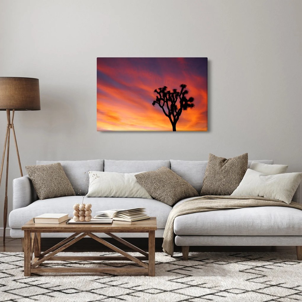 Vászonkép - Naplemente egy fa sziluettje felett (90x60 cm)