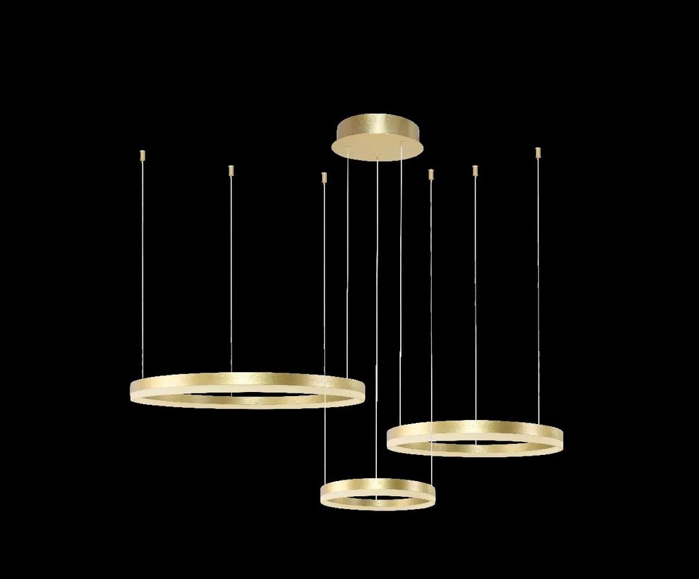 Arany dekoratív lámpa Halo 3 arany térgyűrűk elegáns asztal felett