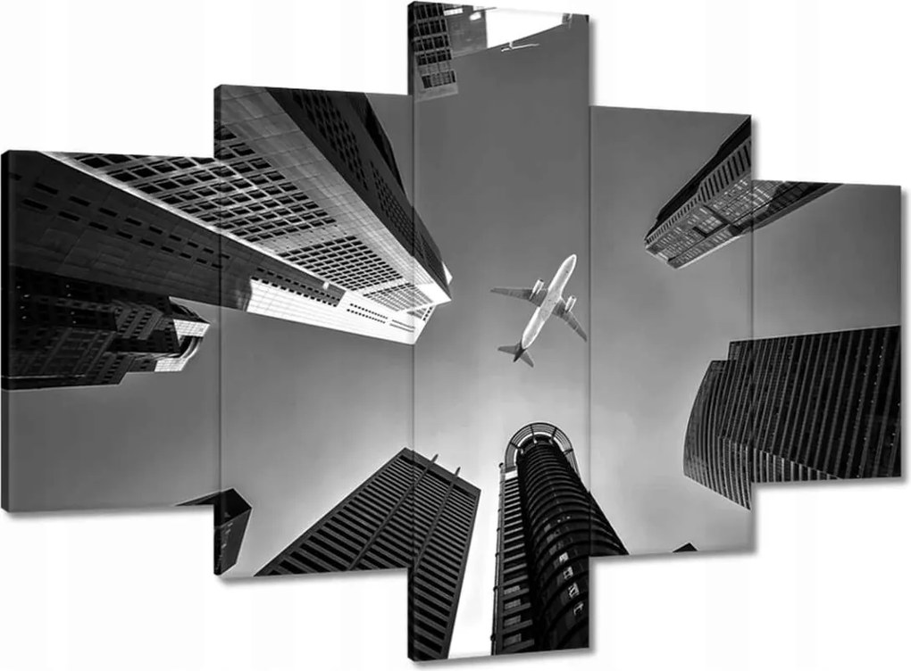 Vászonkép 100x70 Repülőgép a város felett