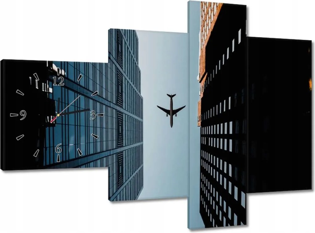 Faliórák 100x70 Repülőgép az épületek között