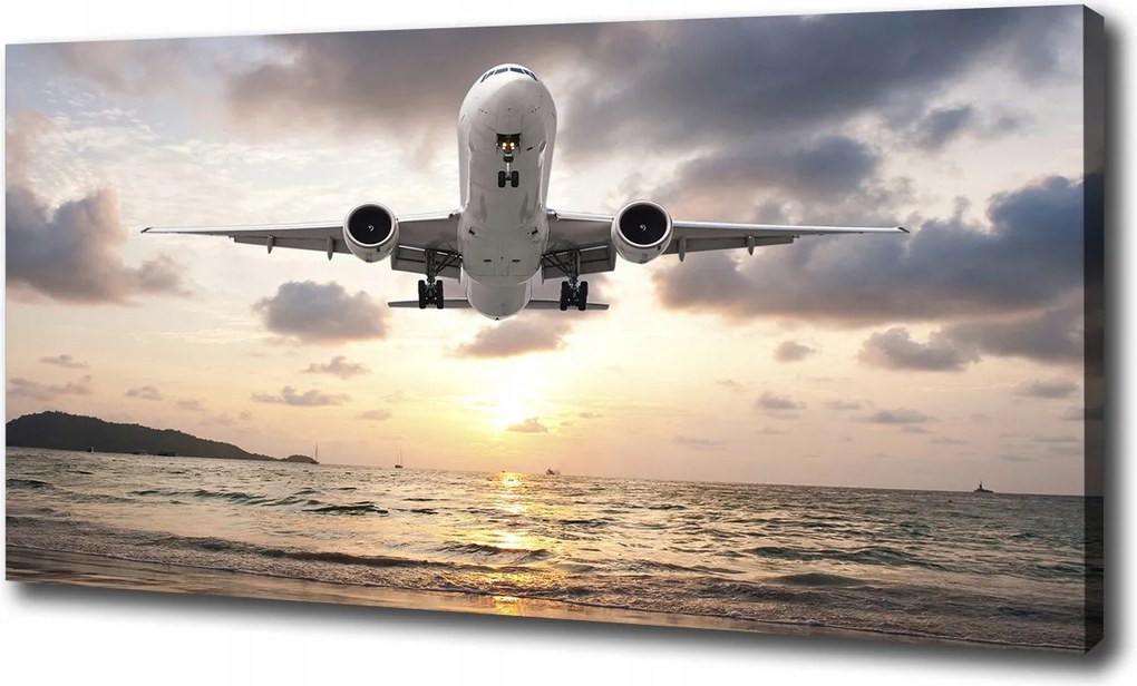 Vászonkép Repülőgép a tengerparton 100x70 cm