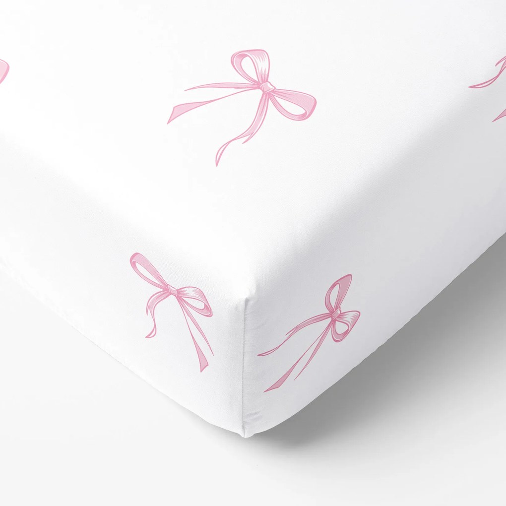 Goldea pamut körgumis lepedő - rózsaszín masnik 120 x 200 cm