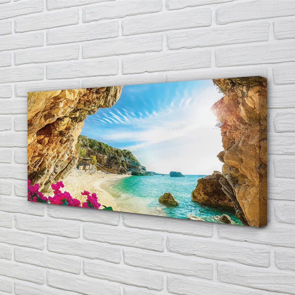 Canvas képek Görögország parti sziklák virágok 125x50 cm