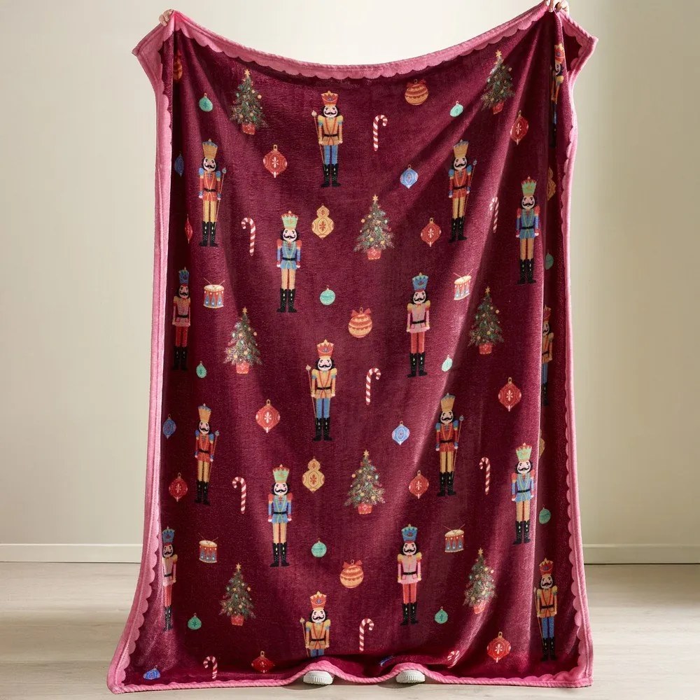 Borvörös-rózsaszín takaró karácsonyi mintával 170x130 cm Christmas Nutcracker – Catherine Lansfield