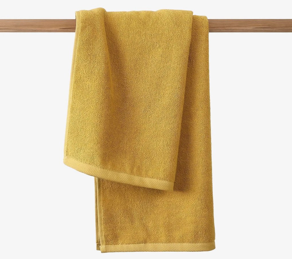 Goldea bordűr nélküli frottír törölköző és fürdőlepedő soft – mustárszínű 30 x 50 cm