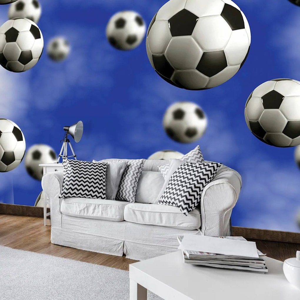 Fotótapéta - Futball-labdák a kék háttérben (152,5x104 cm)
