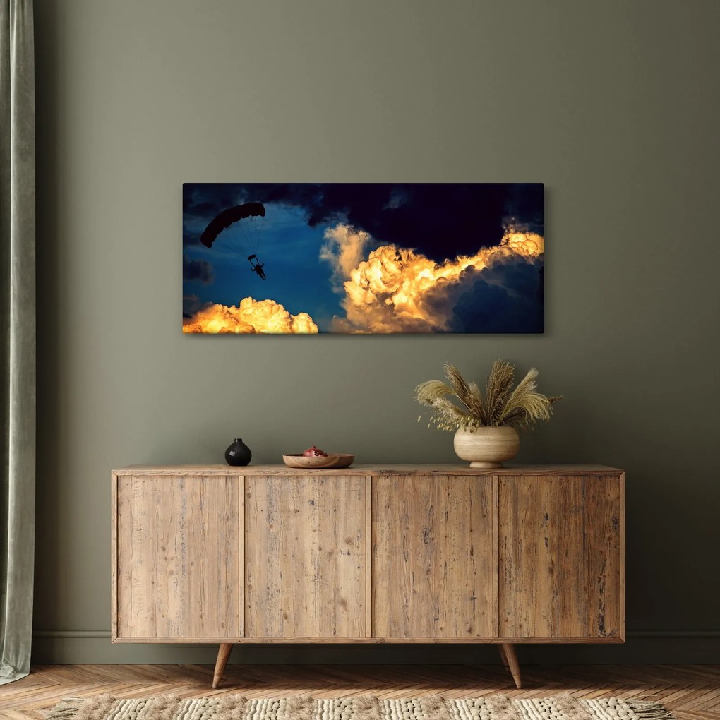 Ejtőernyős a felhőkben képe (120x50 cm)
