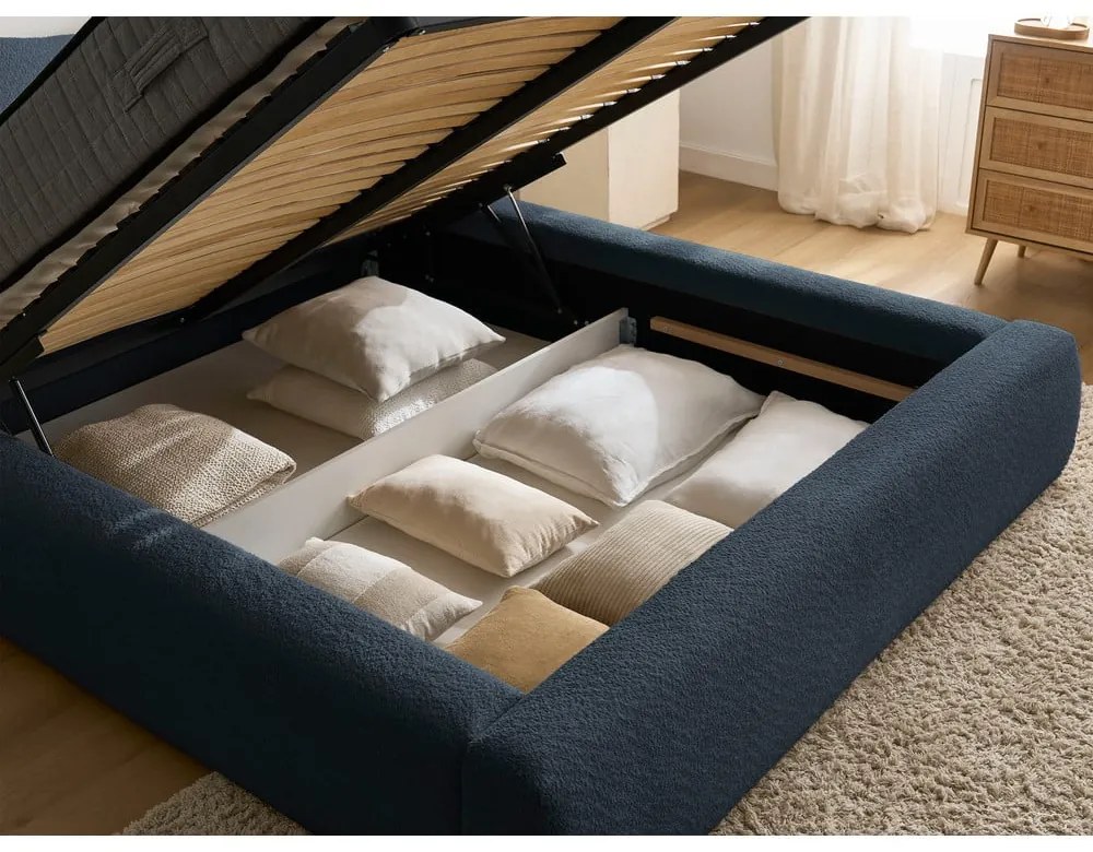 Sötétkék kárpitozott ágyneműtartós franciaágy ágyráccsal 140x190 cm Orlane – Bobochic Paris