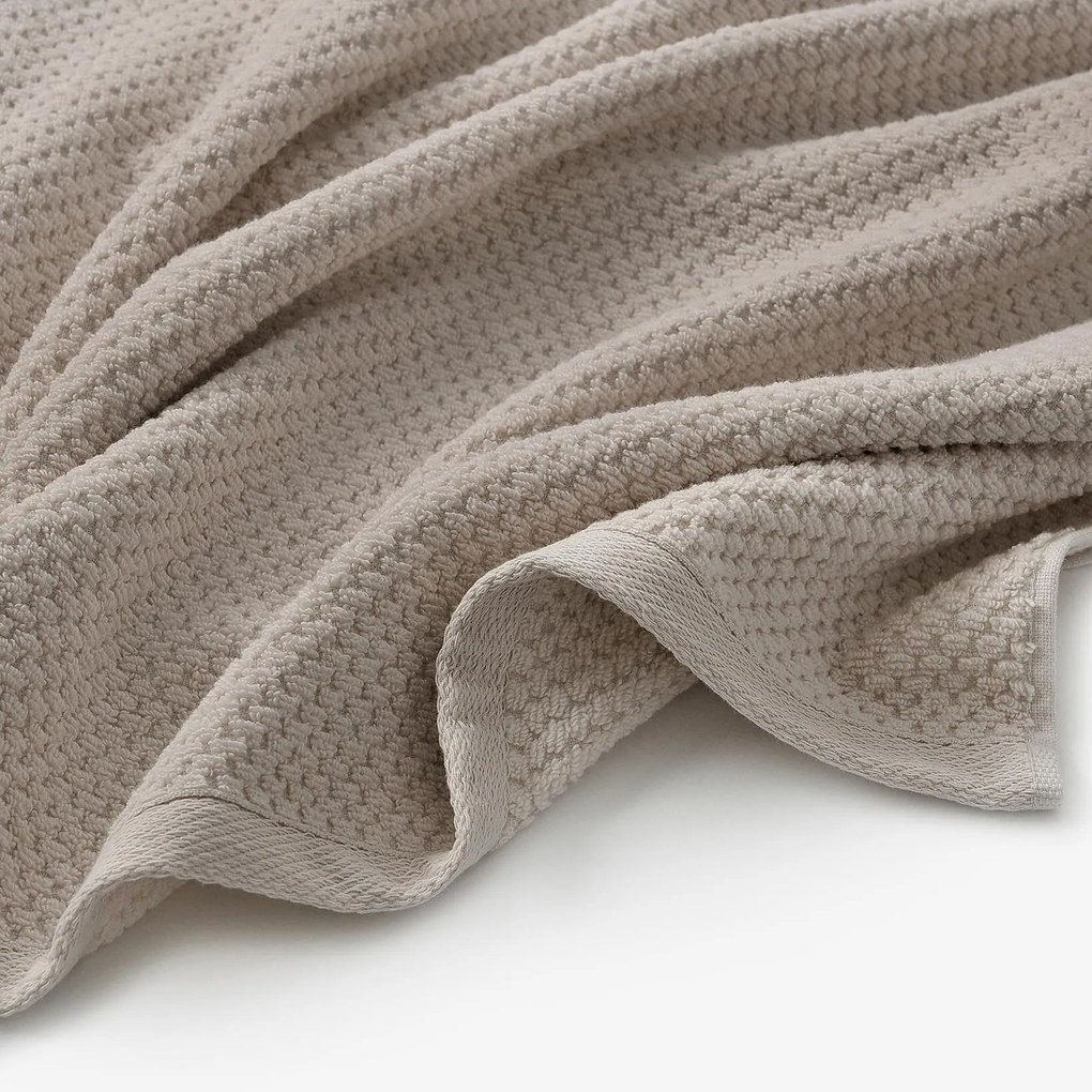 Goldea pamut frotír törölköző / fürdőlepedő micro pure - szürkésbarna 30 x 50 cm
