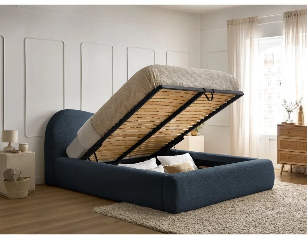 Sötétkék kárpitozott ágyneműtartós franciaágy ágyráccsal 140x190 cm Orlane – Bobochic Paris