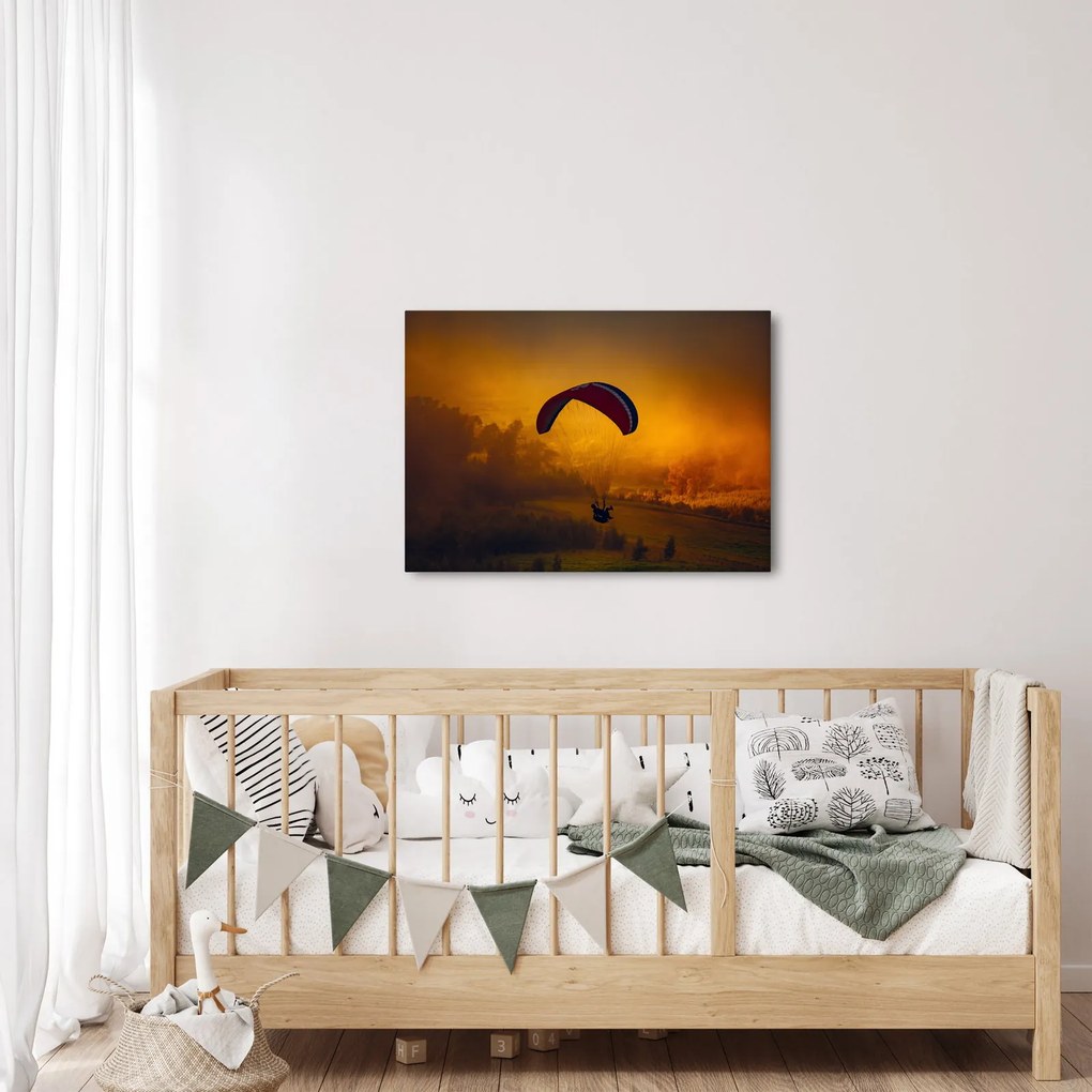 Ejtőernyős a naplementében képe (70x50 cm)
