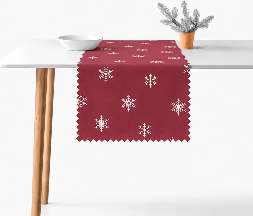 Goldea karácsonyi teflonos asztali futó - hópelyhek piros alapon 50x120 cm