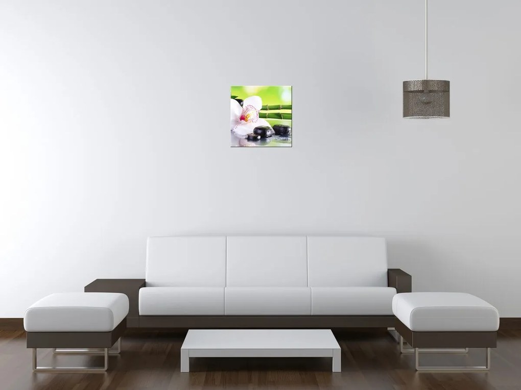 Gario Vászonkép Fehér orchidea és kövek Méret: 100 x 70 cm