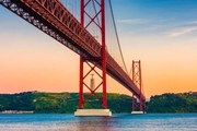 Fotográfia 25th of April Bridge Lisbon Portugal at Sunset, © Allard Schager