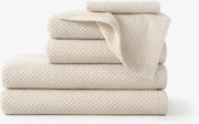 Goldea pamut frottír törölköző / fürdőlepedő micro pure - mandulaszín 70 x 140 cm