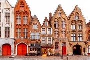 Fotográfia Medieval houses standing in a row, Bruges, Belgium, Alexander Spatari