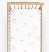 Goldea gyermek gumis pamut lepedő kiságyba - rózsaszín masnik 60 x 120 cm