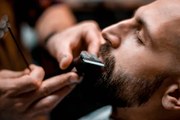 Fotográfia Man getting his mustache shaped by, EXTREME-PHOTOGRAPHER