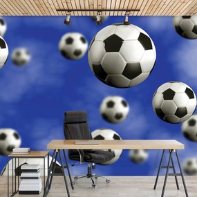Fotótapéta - Futball-labdák a kék háttérben (152,5x104 cm)