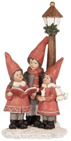 Villanyoszlop alatt éneklő gyerekek karácsonyi dekoráció