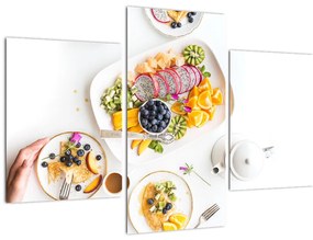 Tányérok gyümölcsökkel az asztalon képe (90x60 cm)