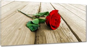 Vászonkép 115x55 Vörös rózsa a deszkákon