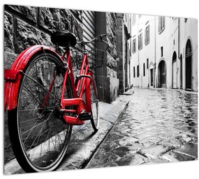 Egy vörös kerék képe egy macskaköves utcán (70x50 cm)