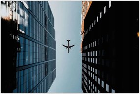 Poszterek 60x40 Repülőgép az épületek között