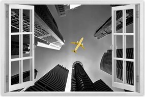 Poszterek 60x40 Sárga repülőgép a város felett