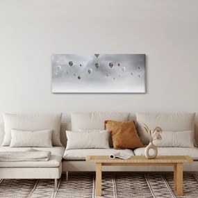 Kép - léggömbök egy téglafal felett (120x50 cm)