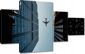 Faliórák 130x80 Repülőgép az épületek között