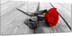 Vászonkép 150x70 Vörös rózsa a deszkákon