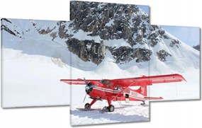 Vászonkép 100x60 Piros repülőgép a hegyekben