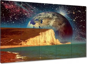 Vászonkép 100x70 Bolygó a tengeri sziklák mögött