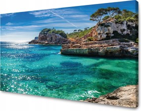 Vászonkép Tájkép Sziklák Víz Fák Nap 120x70 cm