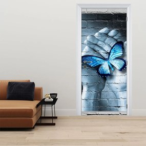 Fotótapéta ajtóra - Kék pillangó a falon (95x205cm)