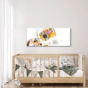 Tányérok gyümölcsökkel az asztalon képe (120x50 cm)